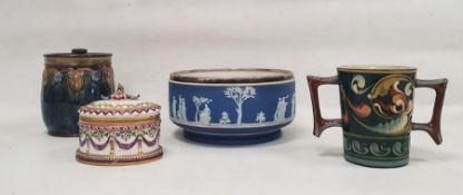 Royal Doulton glazed stoneware biscuit barrel and cover moulded with Art Nouveau whiplash and