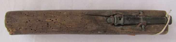 Early 19th century miniature brass cannon mounted to be held in the hand.