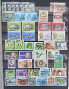 Jamaica stamps: blue stock-book full of mostly used QV-QEII definitives and commemoratives with