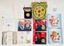 A group of brilliant uncirculated coin sets including (2) 2000 coin year sets, 1999 year set, (2)