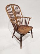 19th century elm and ash hoop back Windsor chair, with carved wheel-shaped splat, with two