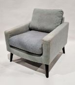 Contemporary upholstered armchair, in pale blue/grey fabric and with drop in cushions, on tapering