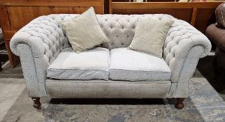 Late 19th/early 20th century reupholstered Chesterfield drop-arm two-seater sofa, upholstered in