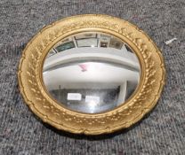 Moulded gilt framed circular convex mirror, 42cm diameter
