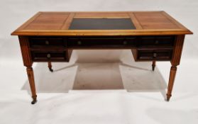 20th century desk with rectangular leather insert to the top, raised over one long and four short