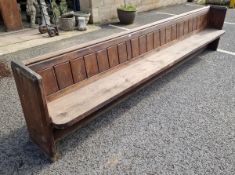 Stained oak church pew with panelled back and chamfered ends, 81cm high x 365cm long x 48cm wide
