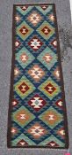 Maimana kilim runner, woven with lozenges in dark red, green, blue, yellow and cream, within a