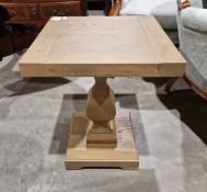 Contemporary pedestal occasional table, of square-section, supported on a faceted pedestal and