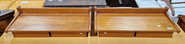 Pair of mid-century teak wall-mounted bedside tables designed by Kai Kristiansen, each with two