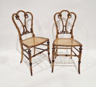 Pair of ornate 19th century dining chairs, the seat back with carved and moulded scrolling motifs