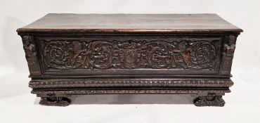 Italian 17th/18th century carved walnut cassone, the front carved in the Renaissance style with a