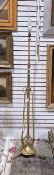 Arts and Crafts brass standard lamp, with adjustable column and tripod scroll supports,