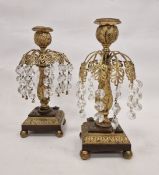 Pair of 19th century gilt-metal and cut glass lustre candlesticks, with foliate sconces, on baluster