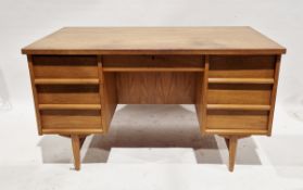 Mid-century Scandinavian teak desk, the single central drawer flanked on either side by three