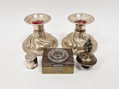 Small silver cylindrical box with anchor and rope-pattern lid, pair white metal candle holders, a