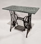Cast iron Singer sewing machine treadle base, adapted into a side table, with a marble top, 75cm