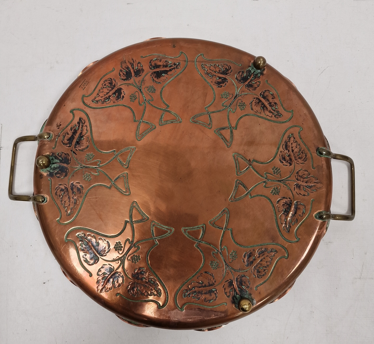 J.S & S Art Nouveau copper two-handled circular tray, cast with fruiting vine and whiplash motifs, - Image 2 of 3