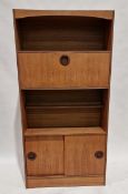 Pair of mid century teak wall units, one with two shelves above cupboard section, the other with