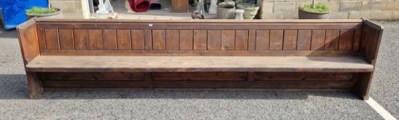 Stained oak church pew with panelled back and chamfered ends, 81cm high x 365cm long x 48cm wide