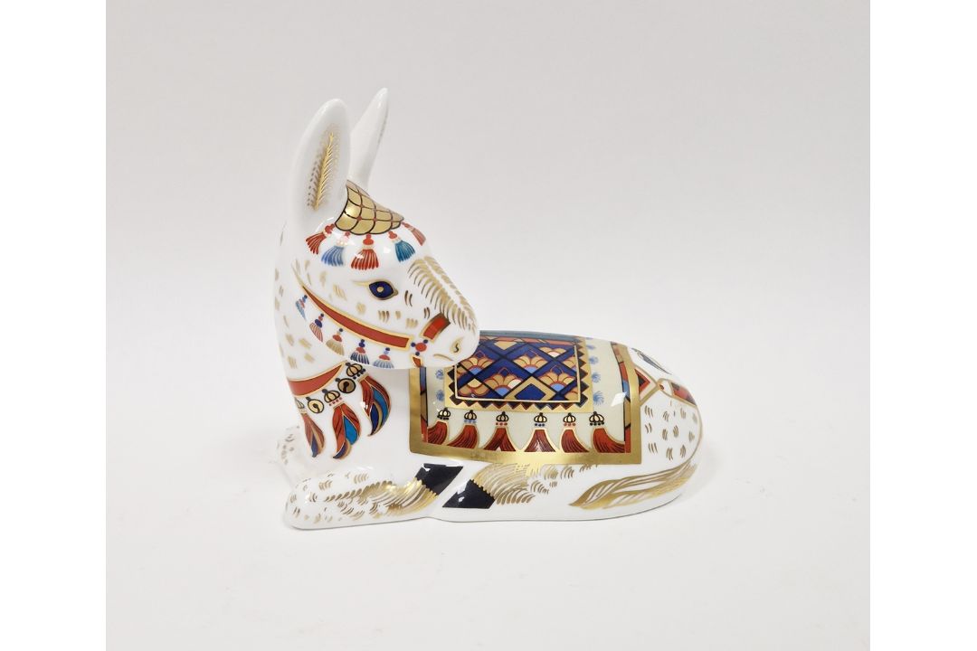 Royal Crown Derby bone china Imari pattern paperweight in the form of a recumbent donkey, printed - Image 1 of 2