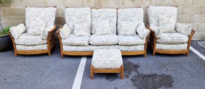 20th century oak three-piece sofa suite by Ercol, design no.1154, comprising a three-seater sofa and