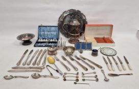 Five various silver coffee spoons, a silver butter knife, a silver-plated on copper covered