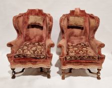 Pair of William & Mary-style upholstered wing back armchairs, each upholstered in dusty/faded pink