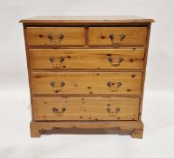 Pine chest of drawers comprising two short over three long drawers, raised on bracket feet, 94cm