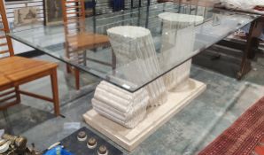 Large contemporary glass-topped dining table, the base in the form of three weathered columns made