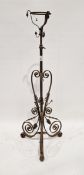 Late 19th century wrought iron torchere/jardiniere stand with adjustable scroll tripod supports