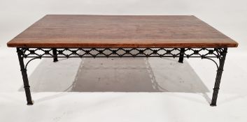 Contemporary stained hardwood coffee table of rectangular form, raised on an ironwork base, 46cm