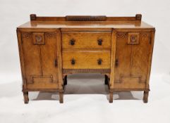 Early 20th century oak sideboard having two central drawers flanked on either side by a single