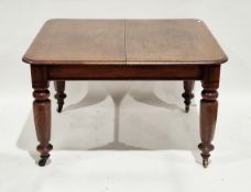 Victorian mahogany extending dining table of rectangular form, with thumb moulding above faceted