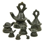 Set of eight bronze graduated weights cast as turtles, in sizes, the two larger with ring handles,