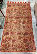 Small machine woven tapestry, woven with lion, elephant and exotic birds amongst trees and foliage
