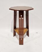Early 20th century Arts & Crafts mahogany occasional table of octagonal form, raised on three
