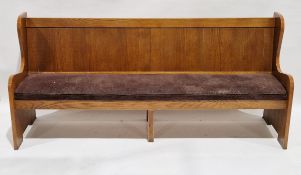 20th century stained and upholstered panelled settle, with curved upright supports, upholstered with