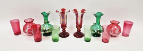 Pair of late Victorian Mary Gregory-style cranberry tinted posy vases, 9.5cm high, a pair of green
