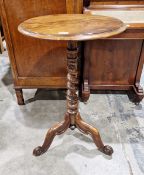 Victorian rosewood wine table of circular form, raised on a tapering barleytwist support, on