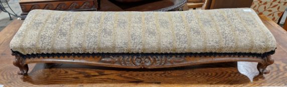 Victorian carved walnut long rectangular footstool, upholstered in striped black and pale ochre
