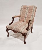 Two walnut framed carved upholstered armchairs, 20th century, one with scroll arm rests and