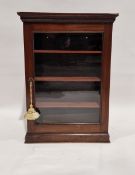 Late 19th/early 20th century mahogany display cabinet of rectangular form, the glazed door opening
