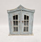 20th century blue and white painted table-top storage cabinet, the two glazed doors opening to