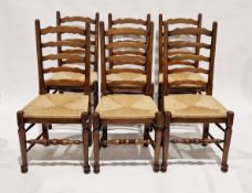 Set of six Arts & Crafts-style stained beech dining chairs (4+2) having slat backs, reel turned