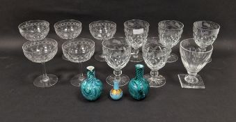Five star-cut and engraved champagne coupes, five thistle engraved diamond-cut rummers, a Regency-