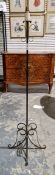 Early 20th century wrought iron standard lamp, with scroll ornament and four interlocking scroll