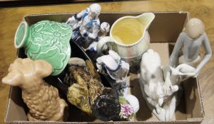 Nao-style figures, one of a girl holding a lamb with a sheep, a girl holding a duck and a girl