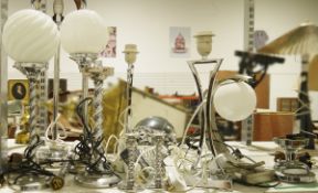A collection of chrome and steel table lamps of various forms with pair of barley twist