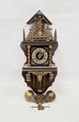 Dutch-style wall clock with brass pear-shaped weights, the pierced and decorated frieze marked 'Nu