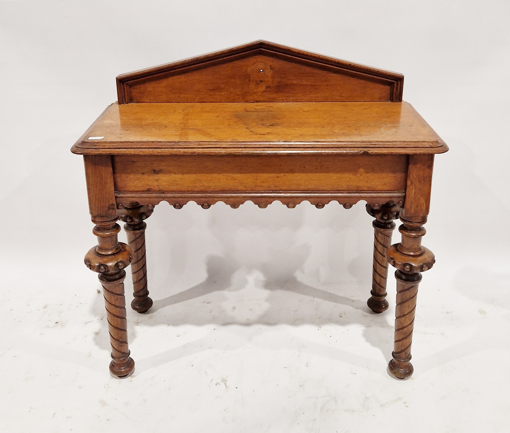 Late 19th/early 20th century oak Gothic style hall table with single drawer to one side, raised on